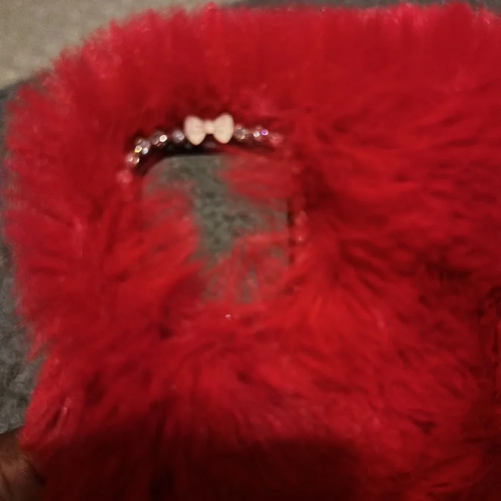 This is a fuzzy red case for a iPhone 11 pro max. There is a few little scratch. - Picture 4 of 4